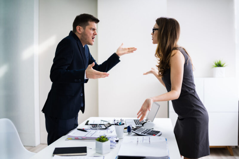 Businessman And Businesswoman Fighting